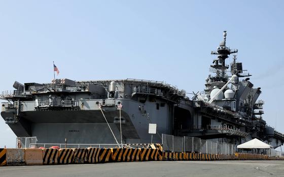 The Amphibious Assault Ship USS America Docks At Manila S South Harbor