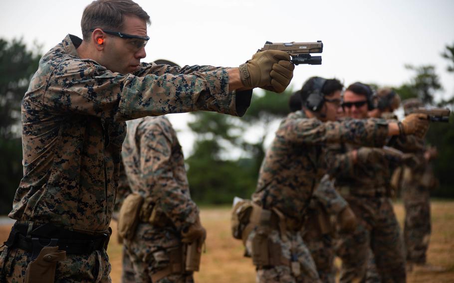 Marine Corps Cpl. Thomas Wilson with 3rd Reconnaissance Battalion, 3rd Marine Division, conducts close-quarters battle training at Camp Schwab, Okinawa, Japan, on Jan. 26, 2021. The Marine Corps wants an improved combat uniform with fire protection, without sacrificing the durability and comfort of the existing digital-pattern combat utility uniform.   

