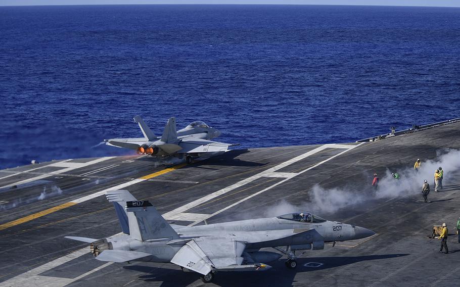 An F/A-18F Super Hornet assigned to the "Black Knights" of Strike Fighter Squadron (VFA) 154 launches from the flight deck of the aircraft carrier USS Theodore Roosevelt on Friday, June 12, 2020. The Theodore Roosevelt Carrier Strike Group is on a scheduled deployment to the Indo-Pacific region.