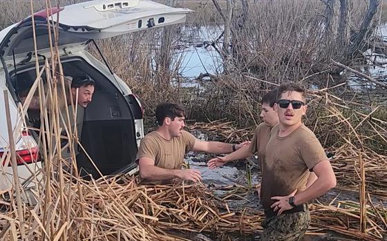 Navy sailors help during an accident in Mississippi.