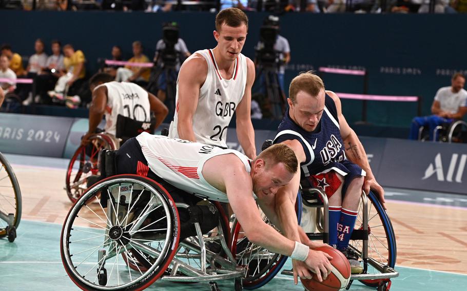 USA's John Boie, right, and The United Kingdom's Gregg Warburton fight for a rebound in the wheelchair basketball championship game at the 2024 Paris Paralympics, Sept. 7, 2024. The U.S. took the gold with a 73-69 win.