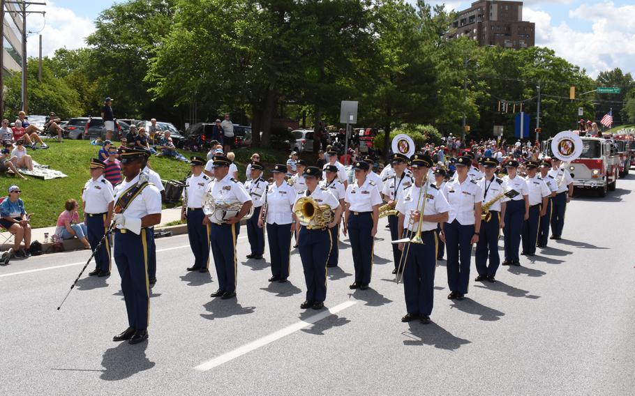 Soldiers in the Maryland National Guard 229th Army Band stand in formation during a parade.