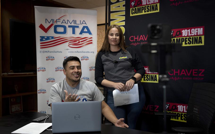 Staff of a Spanish-language radio network in Arizona participate in a phone bank event.