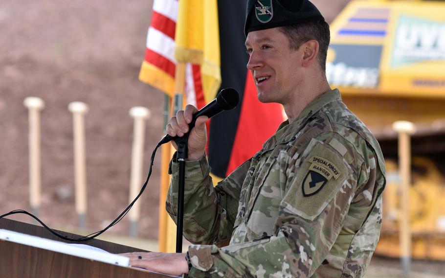 Col. Reid Furman, U.S. Army Garrison Rheinland-Pfalz commander, speaks Wednesday, May 29, 2024, at the groundbreaking ceremony for a new Defense Department elementary school in Baumholder, Germany. The shovels dignitaries used to break ground for the school can be seen in the background.