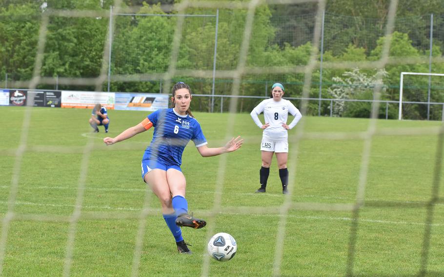 Ramstein's Eleftheria Randitsas takes a penalty kick Wednesday, May 17, 2023, in the semifinals of the DODEA-Europe Division I girls soccer championships. Lakenheath goalkeeper Chloe Aldritch prevented the goal with a diving save in the Lancers' 1-0 victory.