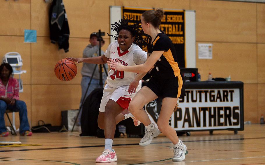 Vernesha Oliver dribbles up the court.