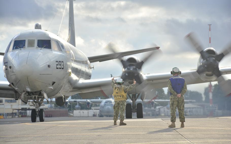 Petty Officer 2nd Class Nana Piccione, left, and Petty Officer 3rd Class Henry Kessler, both assigned to Patrol Squadron 9, launch a P-3C Orion maritime patrol plane at Naval Air Station Sigonella in Sicily in 2015.