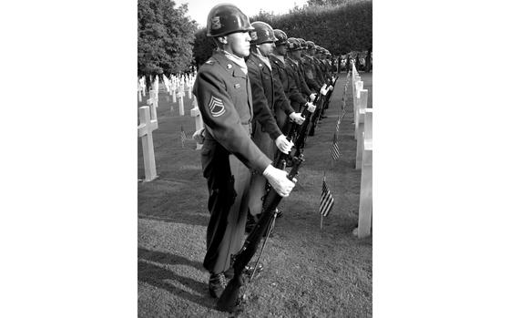 Suresnes, France, September 13, 1952: Soldiers from the 18th Infantry Regiment take part in a dedication ceremony at the military cemetery at Suresnes, just outside of Paris. Among the speakers at the event was retired Gen. and former Secretary of State George C. Marshall, who pledged that U.S. forces in Europe "will not go home until our friends here feel that our presence is no longer essential to their freedom."  

Looking for Stars and Stripes’ historic coverage? Subscribe to Stars and Stripes’ historic newspaper archive! We have digitized our 1948-1999 European and Pacific editions, as well as several of our WWII editions and made them available online through https://starsandstripes.newspaperarchive.com/

META TAGS: Suresnes American Cemetery and Memorial; memorial day; cemetery; World War II; World War I; 