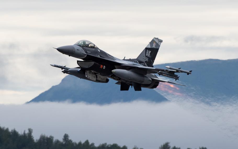 An F-16 Fighting Falcon assigned to the 18th Aggressor Squadron takes off at Joint Base Elmendorf-Richardson, Alaska, July 11, 2023. The squadron is now known as the 18th Fighter Interceptor Squadron.