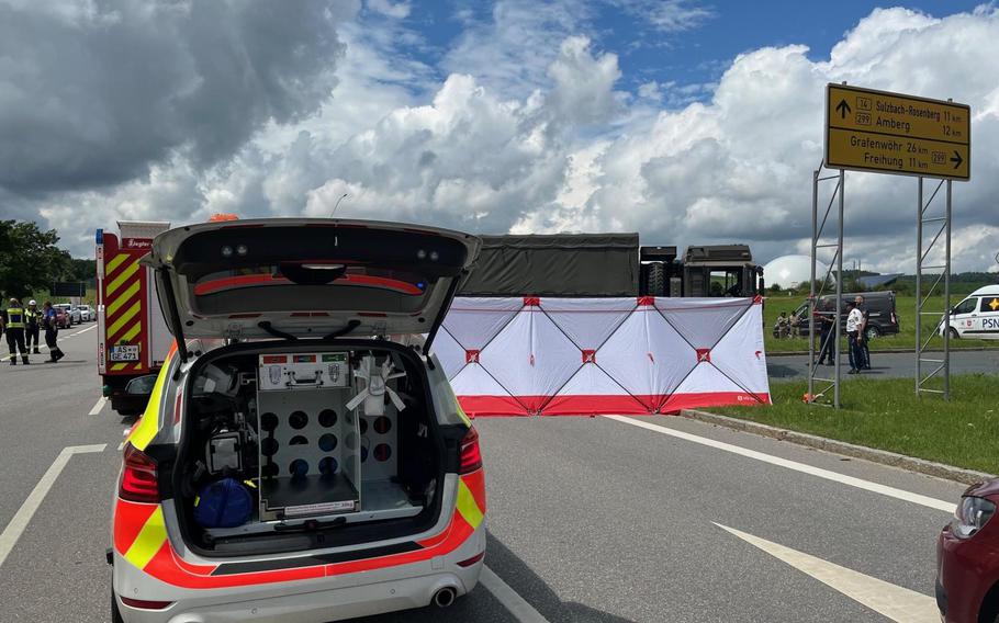 A German paramedic vehicle and privacy screen block off the accident scene where a German teen motorcyclist was struck and killed by a British military vehicle on a Bavarian highway July 11, 2024.