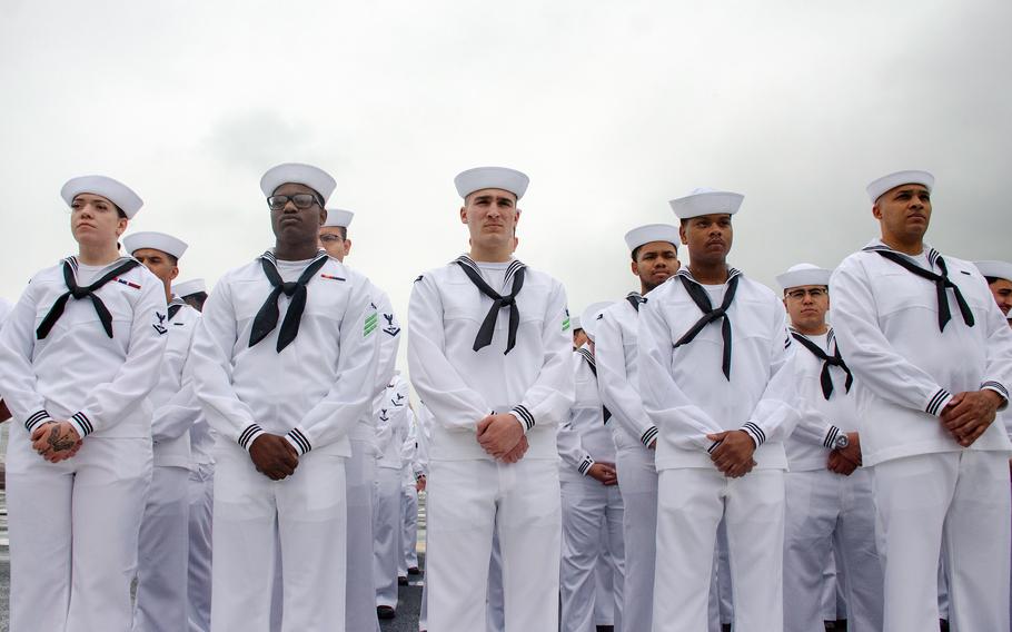 Sailors man the USS Ronald Reagan's rails as the aircraft carrier prepares to depart Yokosuka Naval Base, Japan, May 16, 2024. 