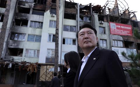 South Korean President Yoon Suk Yeol tours the town of Bucha, Ukraine, July 15, 2023.