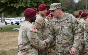 Commanding General of the XVIII Airborne Corps, Lt. Gen. Christopher Donahue, shakes hands with a Soldier assigned to Bravo Company, 1st Battalion, 325th Airborne Infantry Regiment, 82nd Airborne Division, at LSA Castle in Marion, North Carolina, Oct. 15, 2024. Donahue and his team visited Soldiers at LSA Castle who are supporting the Hurricane Helene relief efforts. (U.S. Army photo by Sgt. Alison Strout)