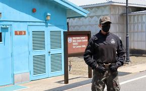 A South Korean soldier stands guard at the Joint Security Area in the Demilitarized Zone, May 9, 2023. 