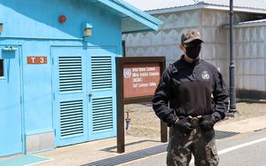 A South Korean soldier stands guard at the Joint Security Area in the Demilitarized Zone, May 9, 2023. 