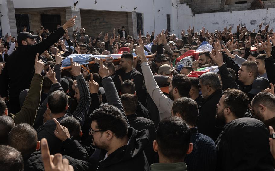 On Jan. 15, hundreds of men attend the joint funeral for the six Palestinians killed in an Israeli attack the night before on Jenin refugee camp in Jenin, West Bank.