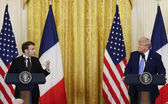 Donald Trump and Emmanuel Macron stand at podiums in front of U.S. and French flags during a press conference.