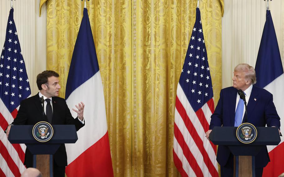 Donald Trump and Emmanuel Macron stand at podiums in front of U.S. and French flags during a press conference.