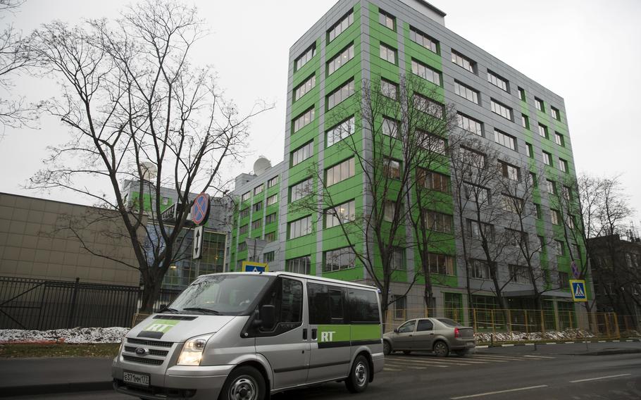 A car of Russian state-owned television station RT passes by the company’s office