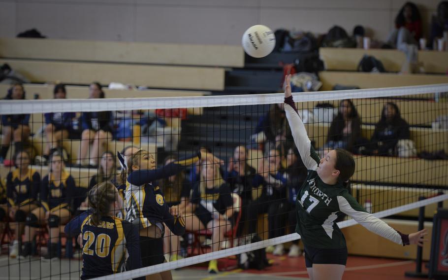 AFNORTH Lion Isabella Guest rises to attempt a block against a shot from Ansbach Cougar Laila McIntyre during the DODEA Division III European volleyball semifinals on Oct. 27, 2023, in Kaiserslautern, Germany.