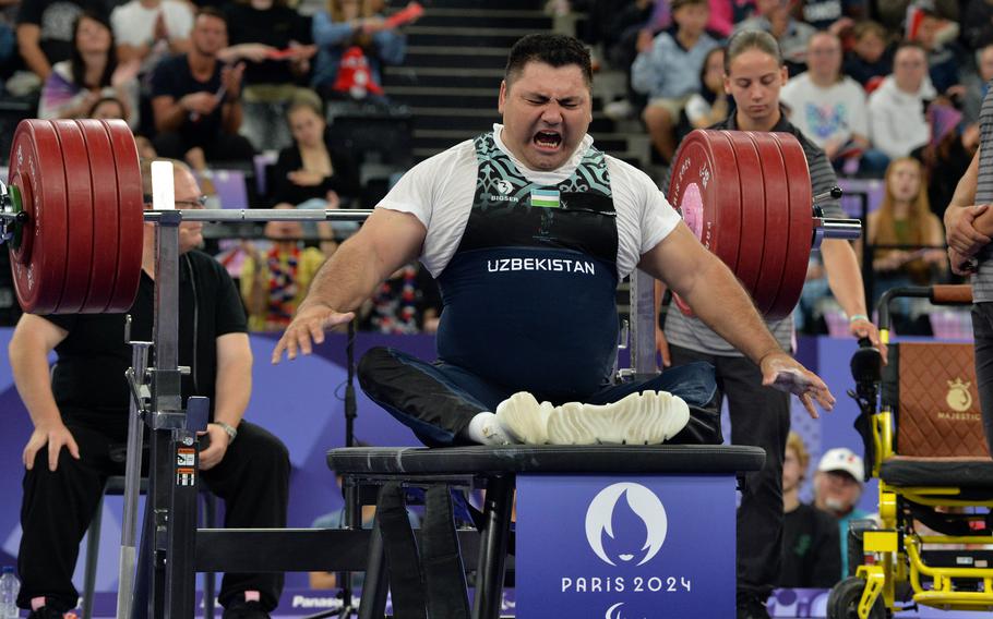 Uzbek powerlifter Ilkhom Khalimov pumps himself and the crowd up before his final attempt at 232 kilograms, or 511.5 pounds, at the para powerlifting competition at the 2024 Paris Paralympics., Sept. 8, 2024. The attempt failed.