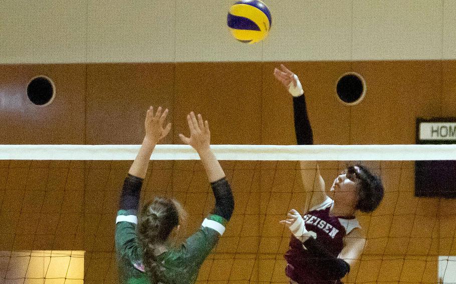 Seisen International's Linnea Rocha spikes against Kubasaki's Isabella Garza during Thursday's American School In Japan YUJO Tournament match. The Dragons won in three sets.