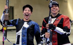 Sagen Maddalena, a U.S. Army sergeant reacts to winning the silver medal in the womens 50-meter rifle three-position competition at the 2024 Paris Olympics at the Chateauroux Shooting Centre, in Chateauroux, France Aug. 2, 2024. At right is gold medal winner Chiara Leone of Switzerland.