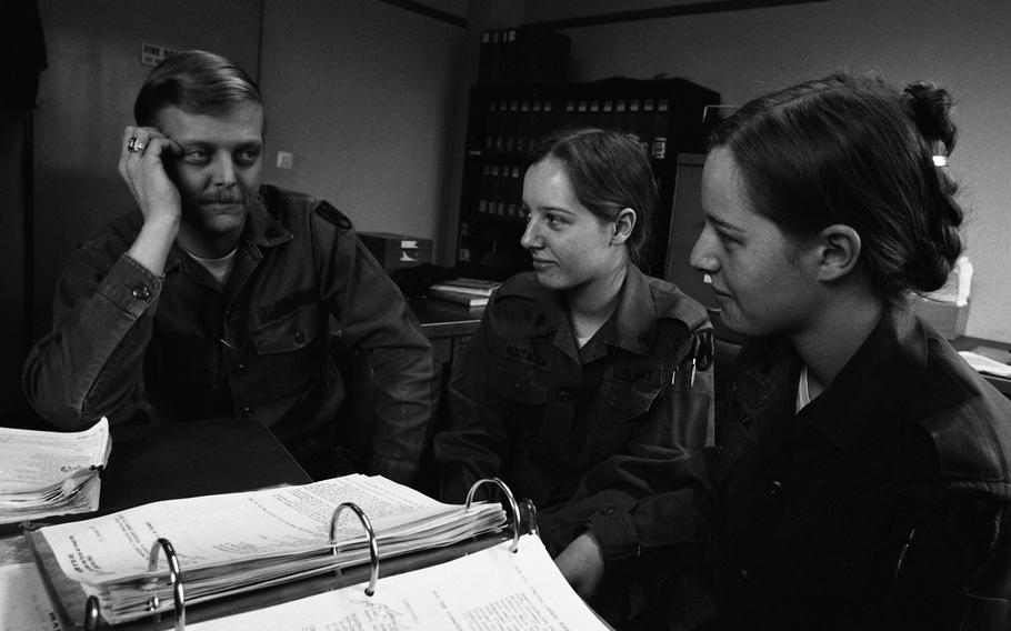 Army twins Paula and Patricia Mataya and Spec 5 David Montgomery at the offices of the 517th Maintenance Company where they work.