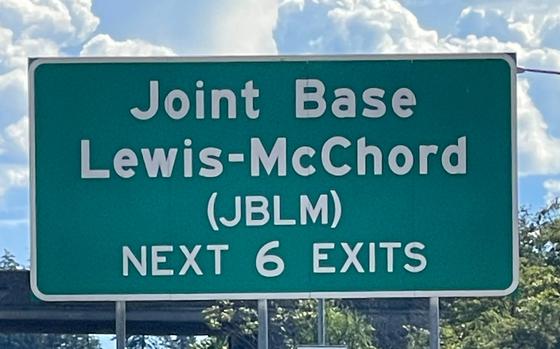 An exit sign for Joint Base Lewis-McChord on Interstate 5 near Tacoma, Wash.