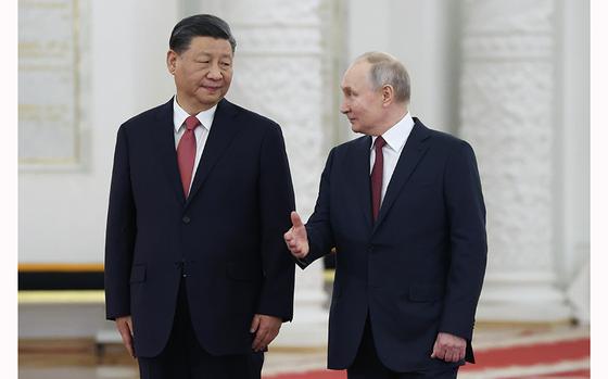 FILE - Russian President Vladimir Putin, Right, Speaks To Chinese ...