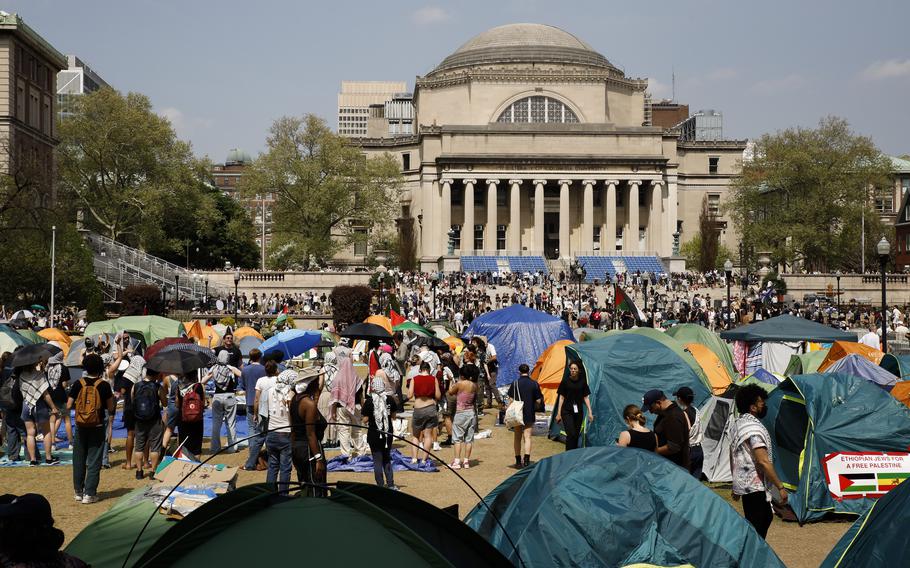 Student protesters gather inside their encampment