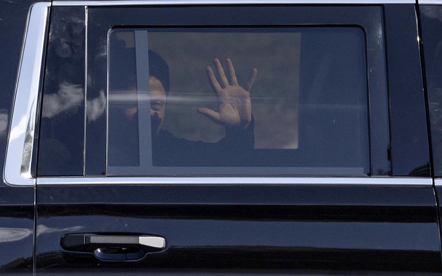 Ukraine President Volodymyr Zelenskyy waves from the back seat of a U.S. Secret Service vehicle in Pennsylvania