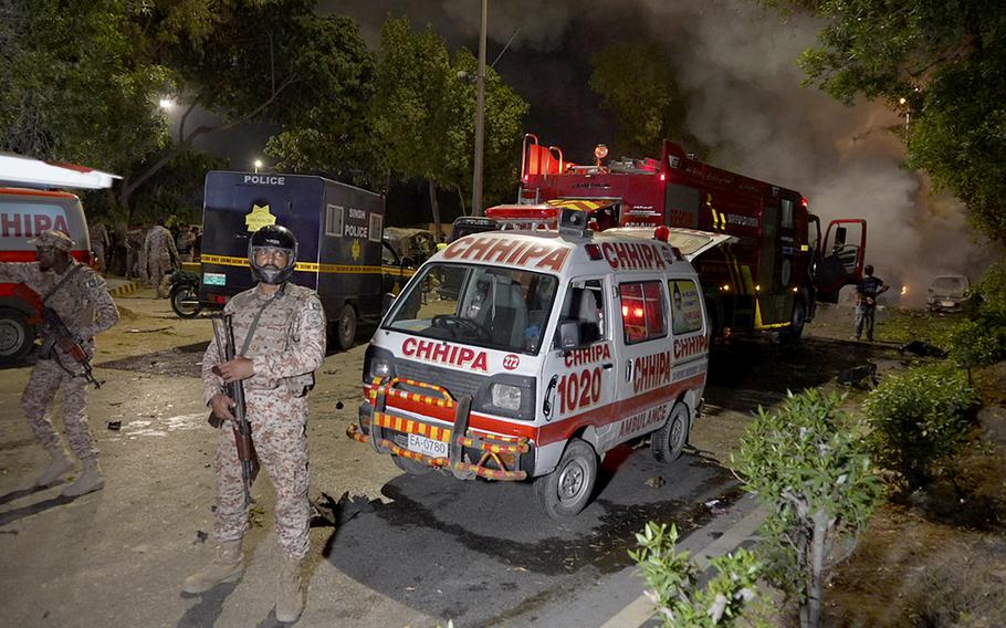 Paramilitary soldiers stand guard nearby Karachi airport following an explosion.