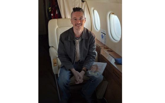 This photo provided by the The Crisis and Support Centre of the Ministry for Europe and Foreign Affairs on Thursday, March 20, 2025 shows France's Olivier Grondeau sitting in a plane after being freed by Iran. (MEAE/CDCS via AP)