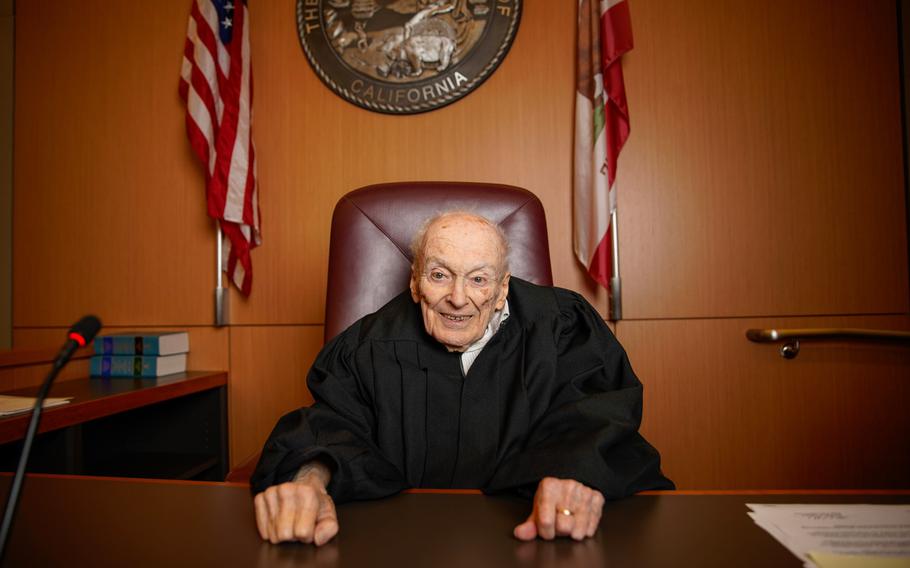 Judge David Gill sits for photo inside his courtroom at the San Diego Central Courthouse downtown on Aug. 21.