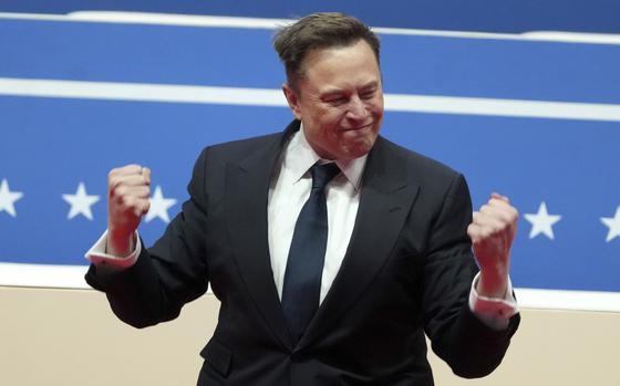 Elon Musk arrives to speak at an indoor Presidential Inauguration parade event in Washington, Monday, Jan. 20, 2025. (AP Photo/Matt Rourke)