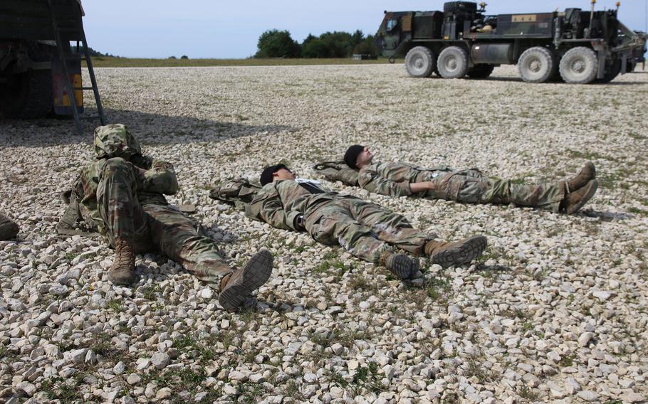 U.S. soldiers rest before training