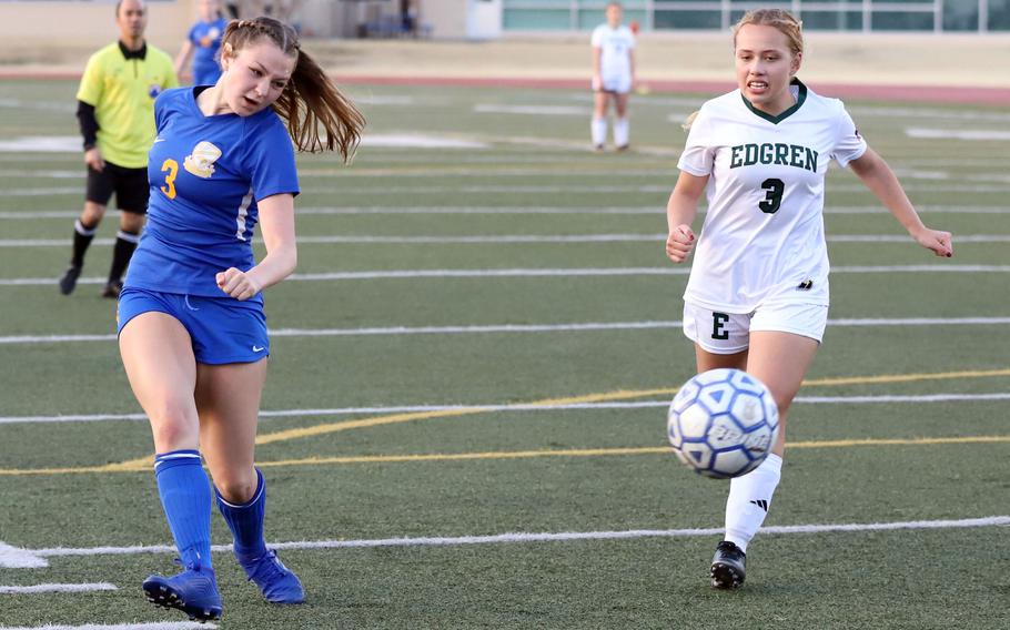 Hailey Smith kicks the ball.