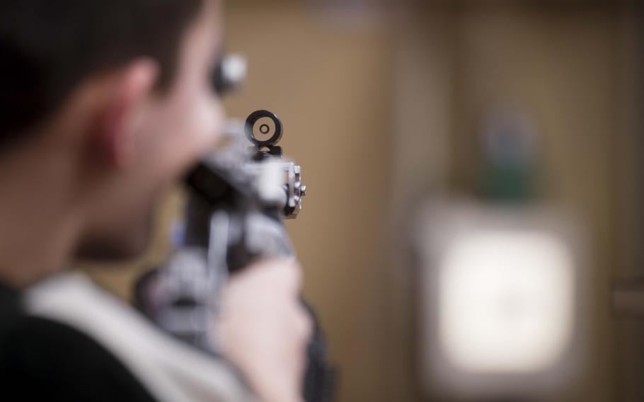 A competitor looks through his scope.