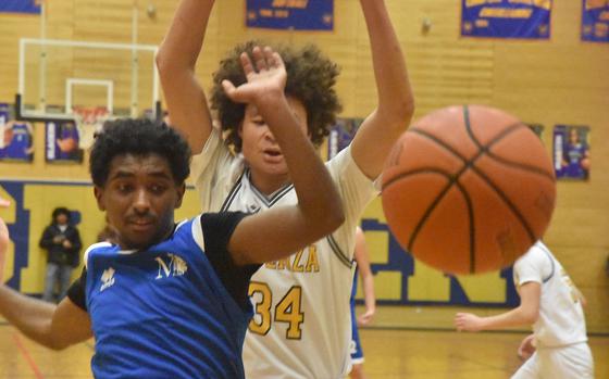 Marymount's Hiyab Haile and Vicenza's Simon Gilbert watch the ball sail out of bounds Thursday, Feb. 13, 2025, at the DODEA-Europe Division II boys basketball championships in Wiesbaden, Germany.