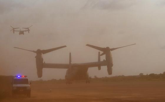  An Osprey aircraft takes off from Kismayo, Somalia, in a cloud of dust.