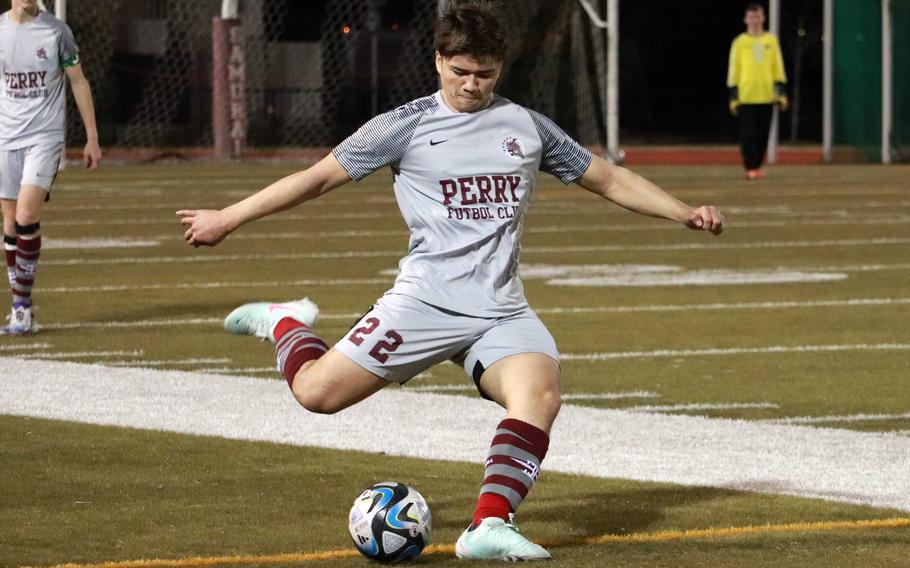 Noah Charles tries to kick the ball upfield.