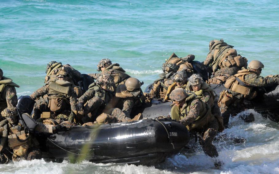 U.S. Marines pull their rubber raiding crafts toward Kin Blue Beach.