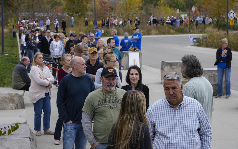 Americans line up to vote.