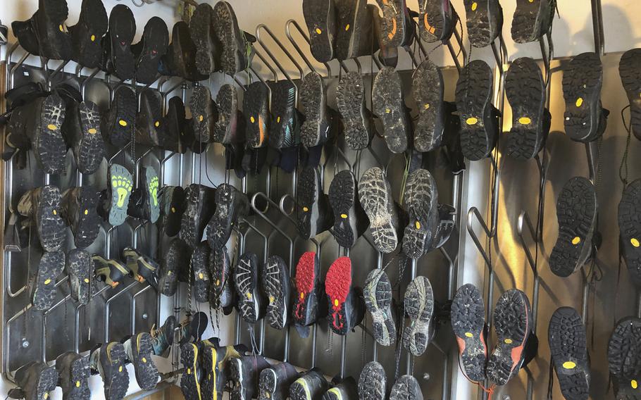 Hiking boots are displayed in a drying room, in a hut in Berchtesgaden National Park in Germany on June 29 2022. The drying room, where heated metal bars dry out wet hiking boot, is an essential element of many German huts. 