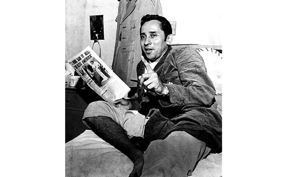 Former POW Everett Alvarez Jr. reads a copy of Stars and Stripes as he relaxes in the hospital after his release from the Hanoi Hilton in 1973.