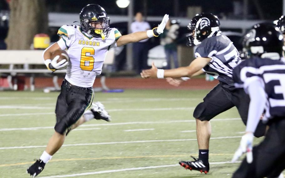 P.J. Lorenzo runs with the ball.