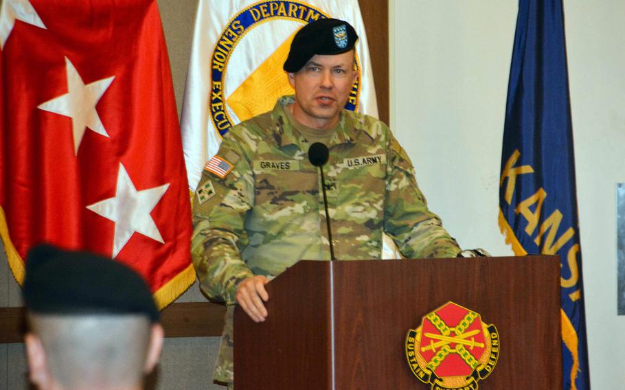 Army Col. Seth Graves, Camp Humphreys' outgoing commander, gives a farewell speech during a change-of-command ceremony at the Morning Calm Center on the base south of Seoul, South Korea, Tuesday, July 11, 2023.