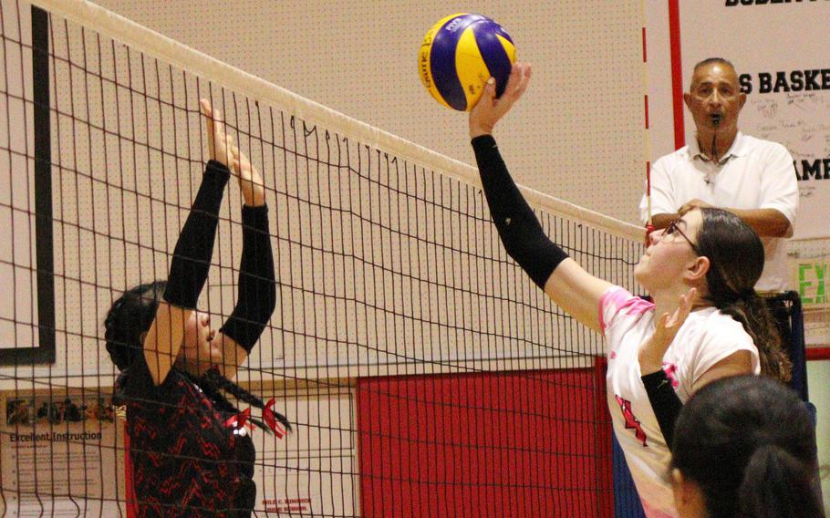 Nile C. Kinnick's Giovanna Kennedy spikes against Yokohama International during Wednesday's Kanto Plain girls volleyball match. The Red Devils won in two sets.