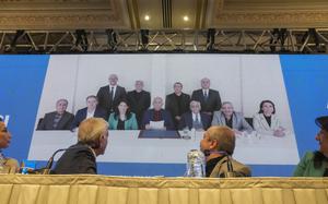 Pro-Kurdish Peoples' Equality and Democracy Party, or DEM, delegation members release an statement from the jailed leader of the rebel Kurdistan Workers' Party, or PKK, Abdullah Ocalan, center at the background photo, in Istanbul, Turkey, Thursday, Feb. 27, 2025. (AP Photo/Khalil Hamra)